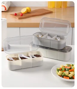 3-compartment seasoning box with clear lid and spoons, perfect for kitchen spice organization.