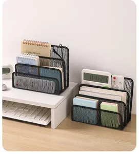 Detailed view of black metal mesh desk organizer holding notebooks and stationery items.