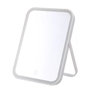 Portable desktop LED makeup mirror with adjustable light and stand on white background