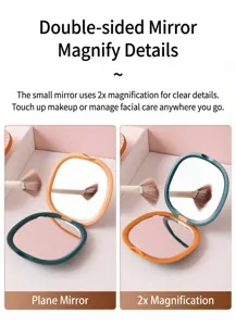 Detailed view of square portable folding travel mirror showing flat and 2x magnification sides