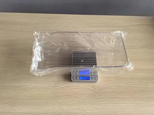 Detailed weight measurement of the transparent food-grade refrigerator storage box.