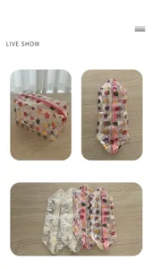 Detailed view showing colorful floral patterns on transparent waterproof PVC makeup bags.