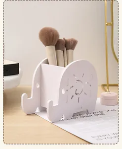 Organizzatore scrivania elefante in legno bianco contenente pennelli per il trucco