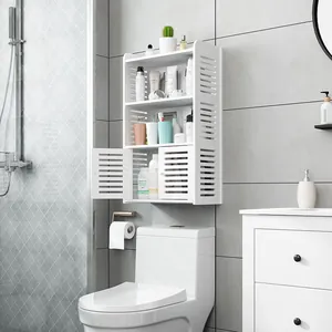White wall-mounted bathroom cabinet installed over toilet for organizing toiletries