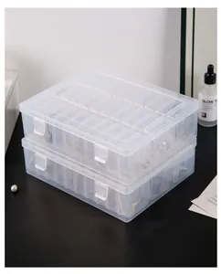 Stacked clear partitioned jewelry boxes showing multi-grid storage for earrings and rings