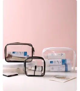 Set aus transparenten, wasserdichten PVC-Reise-Make-up-Taschen mit schwarz-weißem Rand