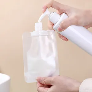 Transparent refillable travel pouch being filled with lotion from a white pump bottle