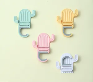 Close-up detail showing four colors of the cactus-shaped adhesive mop holder hook
