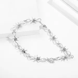 Detailed macro view of a silver-tone hip-hop rock barbed wire thorn necklace for unisex style