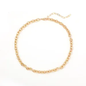 Close-up detail of a shiny gold-tone chunky oval link chain necklace for hip hop style.