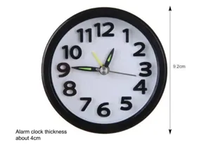Front view dimension detail of round analog alarm clock with luminous hands and 3D numbers