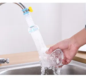 Close-up of a rotatable kitchen faucet sprayer showing splash-proof water flow