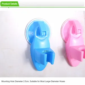 Detailed view of the 2.5cm diameter suction cup shower head holder on a white tile wall