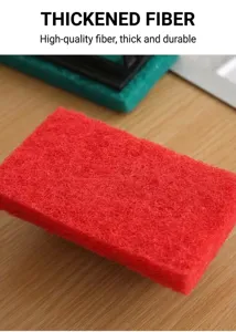 Macro detail of red thickened fiber scouring pad showing high density porous texture