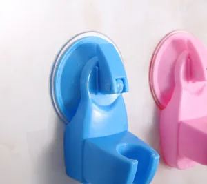 Close-up detail of adjustable plastic suction cup shower head holder with buckle design