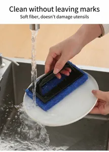 Detail view of blue sponge cleaning brush with handle washing a white plate under running water