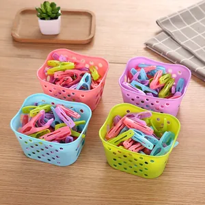 Set of 30 colorful windproof plastic clothespins with small storage baskets for home