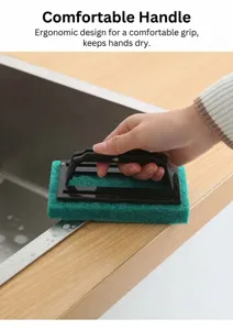 Detailed view of the ergonomic black handle design on this green scouring pad brush