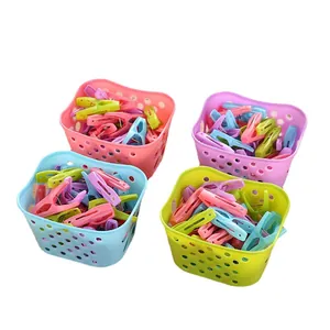 Set of 30 colorful plastic clothespins with 4 small storage baskets for laundry use