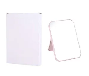 Miroir de maquillage pliable rose avec sa boîte d'emballage blanche minimaliste