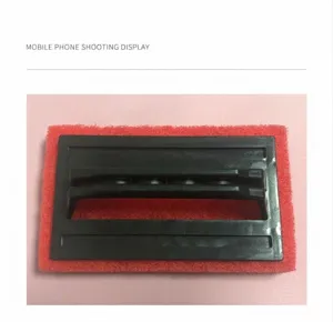 Red scouring pad cleaning brush with black ergonomic handle for bathtub and floor