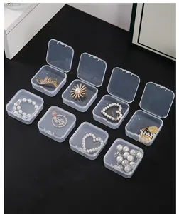 Detail view of small clear square plastic jewelry organizers for earrings and small accessories