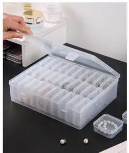 Detailed view of large transparent 28-grid jewelry organizer box for earring storage