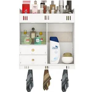 Wall-mounted white bathroom storage shelf with drawers and hooks for toiletries.