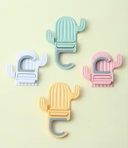 Close-up detail showing the four color variants of the cactus-shaped mop holder hooks