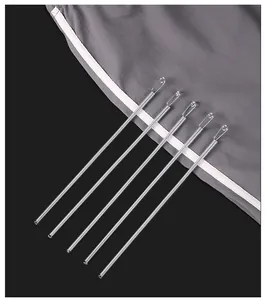 Close-up detail showing five silver flexible metal spring drawstring threader tools