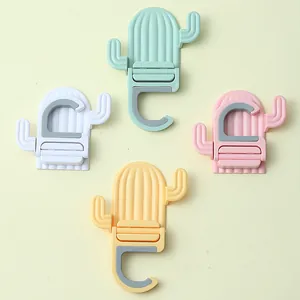 Cactus shaped wall mounted mop holders in four pastel colors for bathroom storage