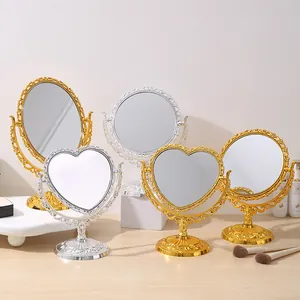 Vintage europäische Herz- und ovale Tischspiegel in Gold- und Silberoptik.