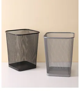 Square metal mesh wastebaskets in black and silver finishes on a minimalist background