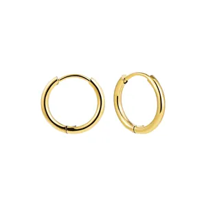 Close-up detail of polished gold stainless steel hoop earrings on white background