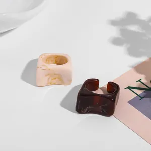 Set of two chunky acrylic square rings featuring marble and tortoise-shell patterns