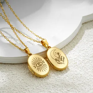 Vintage gold oval locket necklace with moon and evil eye engravings