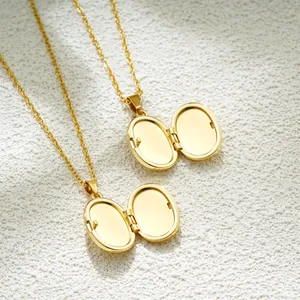Vintage oval gold-plated openable locket necklace with a classic photo frame design