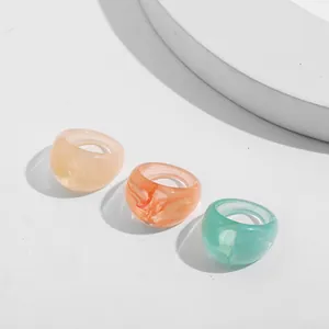 Three chunky acrylic resin rings with marble swirl patterns for trendy women's fashion