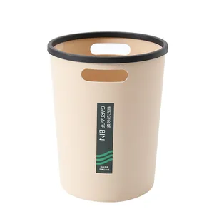 Stijlvolle beige ronde vuilnisbak met handgrepen en zwarte ring voor huis of kantoor