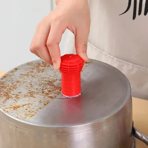 Red nano fiber cleaning stick effectively removing rust and stains from stainless steel pots