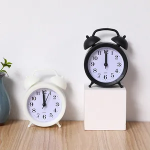 Minimalist silent twin bell alarm clock in black and white for student bedside use