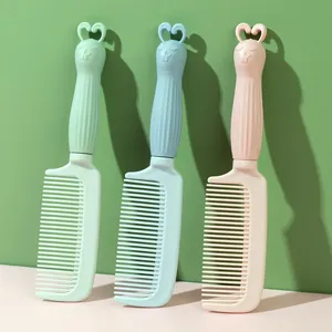Set of three cute cartoon rabbit fine-tooth hair combs in pastel pink, blue, and green