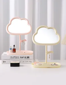 Elegant cloud-shaped desktop makeup mirror with jewelry organizer in pastel colors