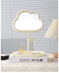 Cream cloud makeup mirror with jewelry tray and star hook in cozy room setting