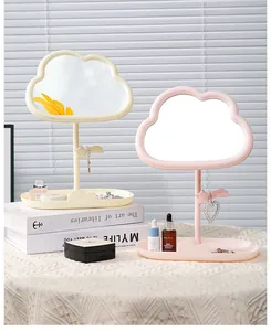 Aesthetic cloud-shaped desktop makeup mirror with jewelry hanging hook and storage tray.