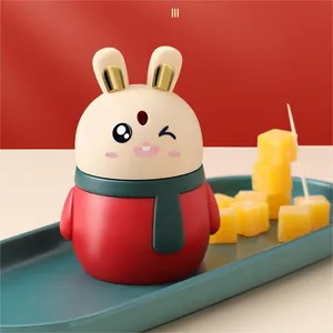 Cute automatic cartoon rabbit toothpick dispenser in vibrant red and cream colors