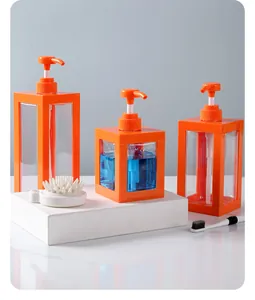 Moderne transparente Seifenspender mit orangefarbenem Rahmen für Lotion und Reisen