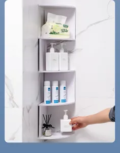 White 4-tier wall-mounted corner storage shelf organized with bathroom essentials