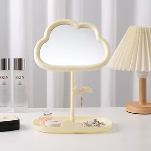 Elegant cream-colored cloud shaped makeup mirror with jewelry tray and star hook