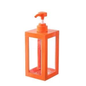 Stilvoller Seifenspender mit orangefarbenem Rahmen und Pumpe für Badlotion und Flüssigseife